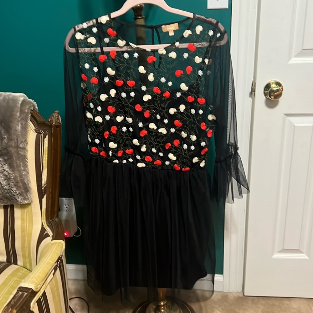 Takara black sheer dress with white and red flowers.